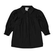 Feminin bluse med smukke smokdetaljer